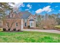 Brick two-story home with attached garage and landscaped lawn at 13833 Jonathans Ridge Rd, Charlotte, NC 28227