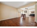 Bright dining area with hardwood floors and views into the living room at 1411 Ladora Dr, Charlotte, NC 28262