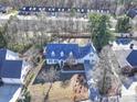 Home situated on a large lot with mature trees and a spacious backyard at 148 Tetbury Ne Ave, Concord, NC 28025