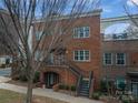 Brick townhome with a staircase and entrance at 211 Harbour Place Dr, Davidson, NC 28036