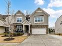 Two-story house with stone accents and a two-car garage at 3020 Sewee Ln, Waxhaw, NC 28173