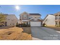 Two-story house with gray siding, white trim, and a driveway at 3126 Elmwood Dr, Monroe, NC 28110