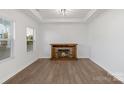 Living room with hardwood floors and a stone fireplace at 3126 Elmwood Dr, Monroe, NC 28110