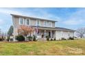 Two-story home with front porch and landscaped yard at 4105 South Fork Ave, Hickory, NC 28602