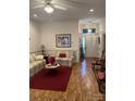 Bright living room featuring hardwood floors and a cozy sitting area at 506 Birmingham Ct, Rock Hill, SC 29732