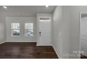 Bright living room with dark hardwood floors and neutral walls at 638 Sagecroft Ln, Indian Trail, NC 28079