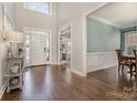 Two-story foyer with hardwood floors and access to other rooms at 7734 Garnkirk Dr, Huntersville, NC 28078