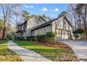 Side view of the house, highlighting the garage and landscaping at 9435 Squirrel Hollow Ln, Charlotte, NC 28720