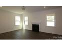 Bright living room with hardwood floors, a fireplace, and recessed lighting at 1136 Yellow Springs Dr, Huntersville, NC 28078