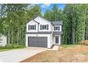 Two story house with white siding, gray garage door, and large windows at 180 Bowman Rd, Statesville, NC 28625