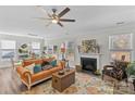 Spacious living room with fireplace, hardwood floors, and comfortable seating at 2151 Black Forest Cv, Concord, NC 28027