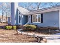 Charming home features a walkway leading to the front door and brick detailing at 217 E Old Highway 74 Hwy # 4, Monroe, NC 28112