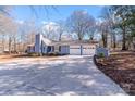 Two-car garage and large driveway enhance curb appeal of this home at 217 E Old Highway 74 Hwy # 4, Monroe, NC 28112