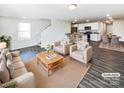 Open living room and kitchen with hardwood floors and neutral decor at 241 Century Dr, Salisbury, NC 28147