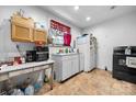 View of kitchen with white cabinets and appliances at 4345 Fish Pond Rd, Salisbury, NC 28146