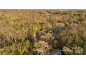 Aerial view showing house among trees and other homes at 612 Harry St, China Grove, NC 28023