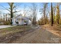 Newly renovated gray house with small front yard at 612 Harry St, China Grove, NC 28023