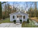 Gray house with white trim and a small front porch at 612 Harry St, China Grove, NC 28023