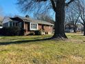 Brick ranch home with tree-lined yard at 813 S Zion St, Landis, NC 28088