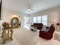 Spacious living room with two leather sofas and a large window at 9027 Daring Ct, Charlotte, NC 28215