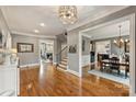 Open concept entryway, view of staircase, dining room and living room at 1105 Hadley Park Ln, Weddington, NC 28104