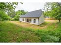 A spacious backyard with healthy green grass and recently constructed home at 117 Chavis Ln, Lincolnton, NC 28092