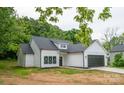 New home boasting white siding, a gray roof, black trim, and a well-maintained lawn at 117 Chavis Ln, Lincolnton, NC 28092