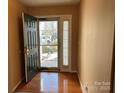 Interior entryway with hardwood floors and door at 2215 Ballingarry Dr, Statesville, NC 28625