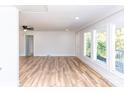 Bright, spacious living room with beautiful vinyl flooring and large windows with a backyard view at 2504 S Cannon Blvd, Kannapolis, NC 28083
