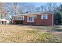 Red brick ranch house with a spacious yard at 408 Elizabeth St, Gastonia, NC 28054