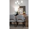 Modern dining area with light-toned wood table and chairs at 82112 Standing Oak Dr, Charlotte, NC 28278