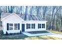 Newly constructed house with white siding and black shutters at 115 Venus Ave, Gastonia, NC 28052