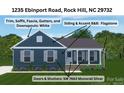 Rendering of new home's exterior showcasing a blue color scheme, white trim, and flagstone front porch at 1235 Ebinport Rd, Rock Hill, SC 29732