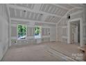 Spacious living room features drywall construction, large windows, ample natural light, and smooth concrete flooring at 1235 Ebinport Rd, Rock Hill, SC 29732