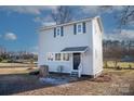 Two-story gray house with a black door and windows at 320 Brown Rd, China Grove, NC 28023
