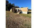 Tan mobile home with wooden steps and satellite dish at 34&20 Shorty Miller Rd, Taylorsville, NC 28681