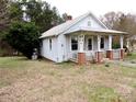 White house with a porch, situated on a grassy lot at 374 Zion Church Rd, Mount Gilead, NC 27306