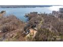 Aerial view of a lakefront house with a spacious lot and stunning water views at 3830 Mill Run, Terrell, NC 28682