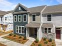 New construction townhome featuring a stylish exterior with a covered entryway and modern finishes at 4121 Walking Ridge Rd # 54, Charlotte, NC 28208
