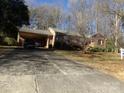 Brick ranch house with carport and driveway at 5514 Grafton Pl, Charlotte, NC 28212