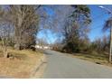 Residential street lined with trees and homes at 5514 Grafton Pl, Charlotte, NC 28212