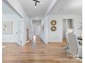 Bright and spacious entryway with hardwood floors, leading to the dining room and stairs at 800 Landau Rd, Waxhaw, NC 28173