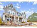 Two-story house with gray siding, stone accents, and a two-car garage at 800 Landau Rd, Waxhaw, NC 28173