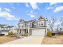 Two-story house with gray siding, stone accents, and a two-car garage at 800 Landau Rd, Waxhaw, NC 28173
