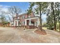 Brick house with a wrap around porch and driveway at 106 Patrick St, Gastonia, NC 28054