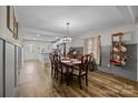 Open concept dining room with a wooden table and chairs, adjacent to kitchen at 1278 Burrell Rd, Clover, SC 29710