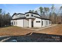 Stylish home with stone accents and a covered entryway at 15650 Youngblood Rd, Charlotte, NC 28278