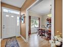 Dining room with wooden table and chairs, access to kitchen at 161 Picwyck Dr, Mooresville, NC 28115