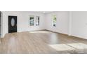 Bright living room featuring light hardwood floors at 250 Franklin Nw Ave, Concord, NC 28025