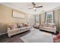 Bright living room with hardwood floors, a ceiling fan, and comfortable seating at 3834 Sipes Ln, Charlotte, NC 28269